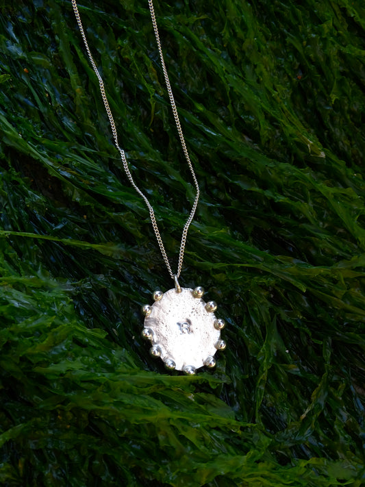 stamped medallion pendants